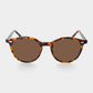 Sunglasses with tortoiseshell frame and brown lenses on a light gray background. - DEI DUCHI