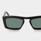 Sunglasses with tortoiseshell frame and green lenses on a light gray background. - De Duchi
