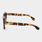 Sunglasses with red-tinted lenses on a light gray background. - Dei Duchi