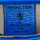 Close-up of a blue leather label with 'Amaltea for Del Duchi Atri' brand leather tag and logo. - DEI DUCHI (Amaltea)