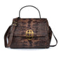 Brown leather textured handbag with a gold clasp on a white background. DEI DUCHI (AMALTEA)