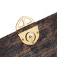 Brown leather textured handbag with a gold clasp on a white background. DEI DUCHI (AMALTEA)