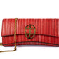 Front view of Red handbag with a chain detail strap, Red clutch bag with a gold emblem/buckle on a white background - DEI DUCHI (ALMATEA)
