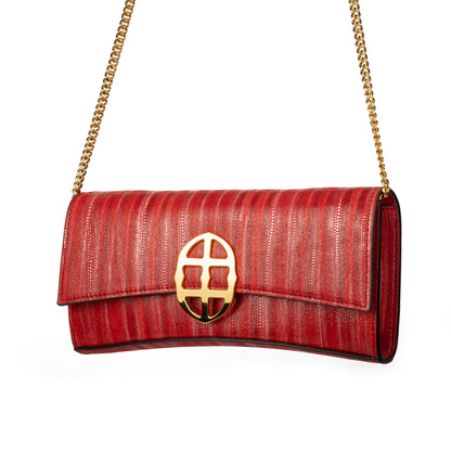 Front view of Red handbag with a chain detail strap, Red clutch bag with a gold emblem/buckle on a white background - DEI DUCHI (ALMATEA)