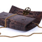 Brown embossed leather python skin clutch bag with gold chain and buckle/emblem on a white background. - DEI DUCHI (AMALTEA)