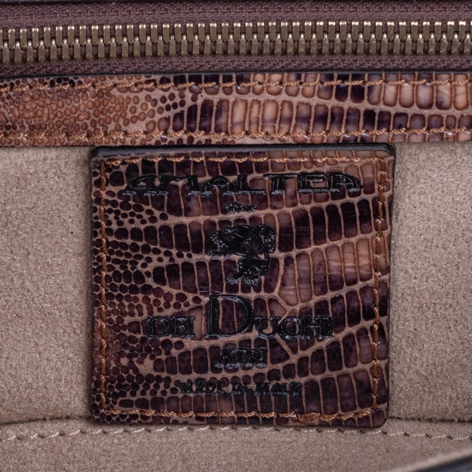 Brown embossed leather python skin clutch bag with gold chain and buckle/emblem on a white background. - DEI DUCHI (AMALTEA)