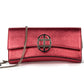 Strawberry Red leather clutch bag/wallet with a burnished metallic emblem buckle on a white background. - DEI DUCHI (AMALTEA)