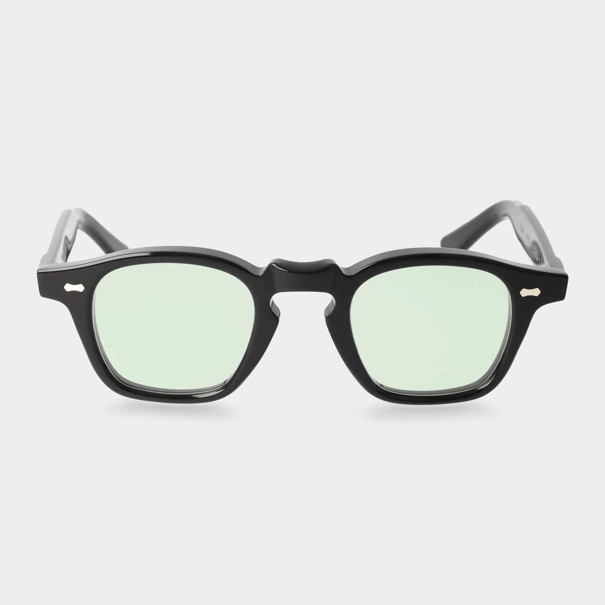 Black-framed sunglasses with light green lenses on a white background - Dei Duchi