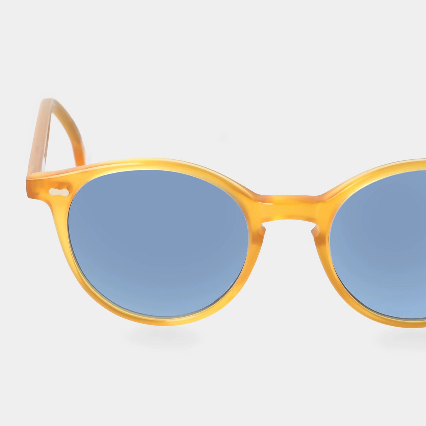 Sunglasses with yellow frame and blue lenses on a white background - Dei Duchi