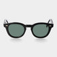 Black sunglasses with green lenses on a white background. - DEI DUCHI