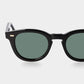 Black sunglasses with green lenses on a white background. - DEI DUCHI