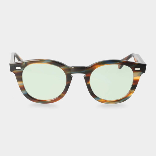 Sunglasses with tortoiseshell frame and green lenses on a white background. - DEI DUCHI