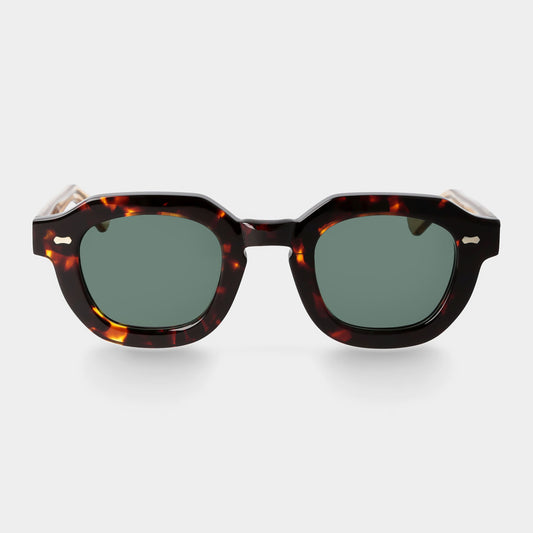 Sunglasses with tortoiseshell frame and dark lenses on a white background. - Dei Duchi