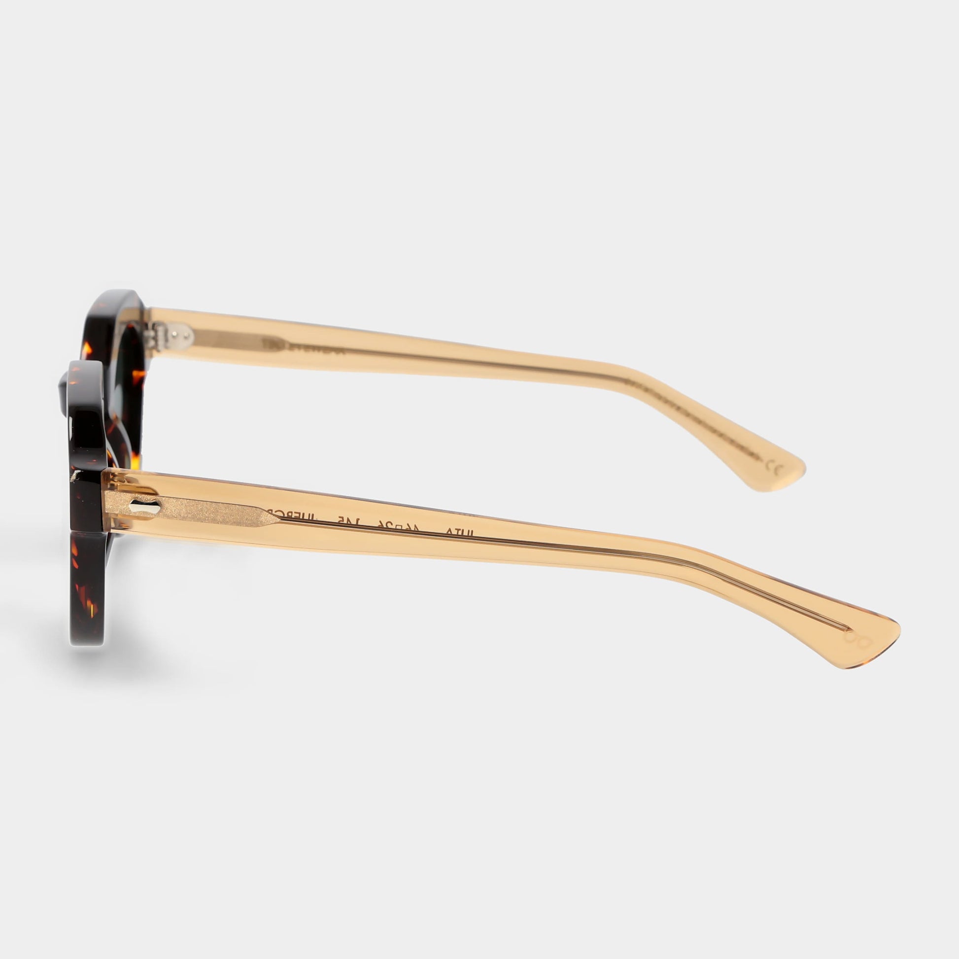 Sunglasses with tortoiseshell frame and dark lenses on a white background. - Dei Duchi