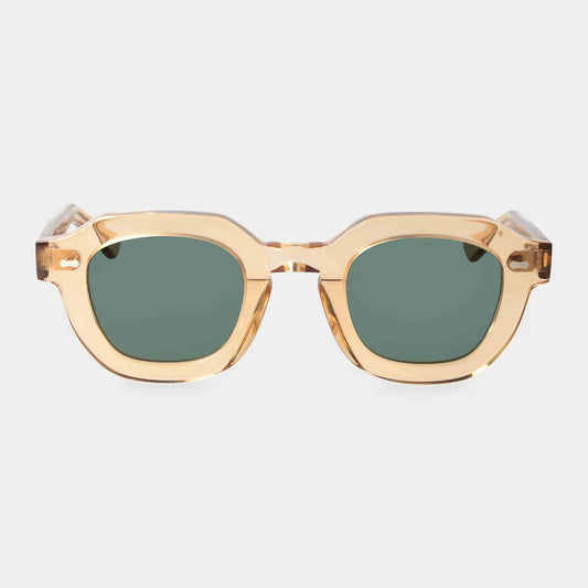 Gold-framed sunglasses with green lenses on a light gray background - Dei Duchi