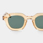 Gold-framed sunglasses with green lenses on a light gray background - Dei Duchi