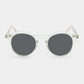 Round sunglasses with clear frame and grey lenses on a white background. - DEI DUCHI