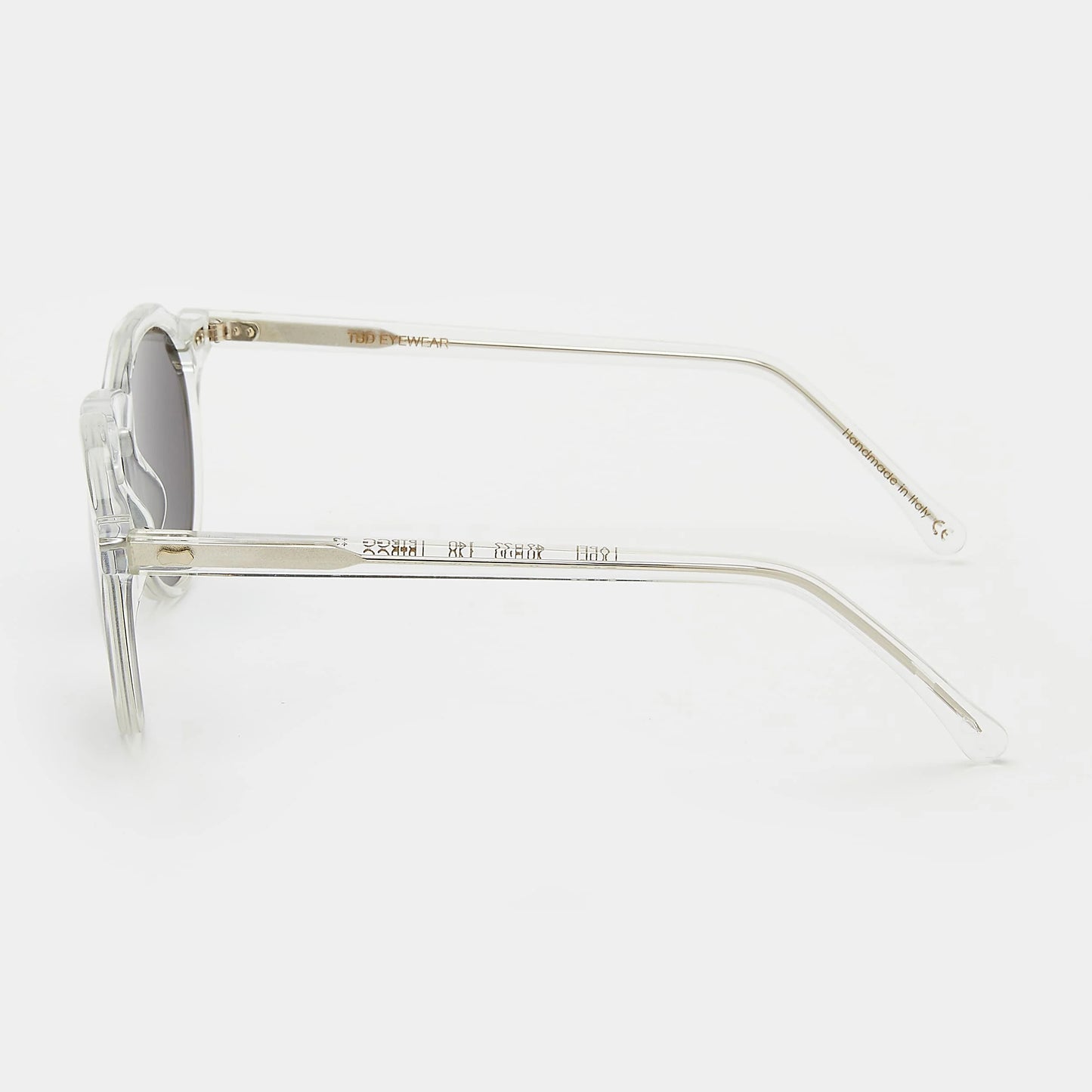 Round sunglasses with clear frame and grey lenses on a white background. - DEI DUCHI