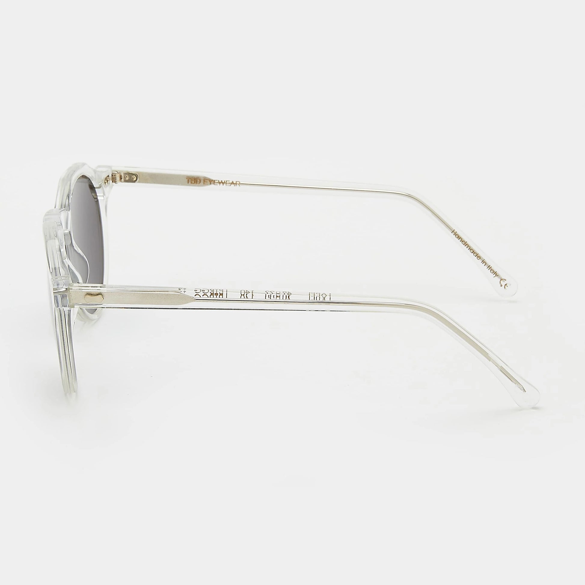 Round sunglasses with clear frame and grey lenses on a white background. - DEI DUCHI