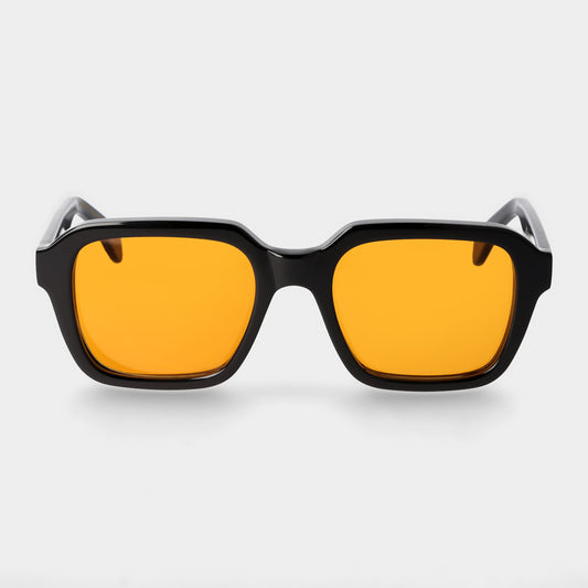 Sunglasses with yellow lenses and black frames on a white background. - DEI DUCHI