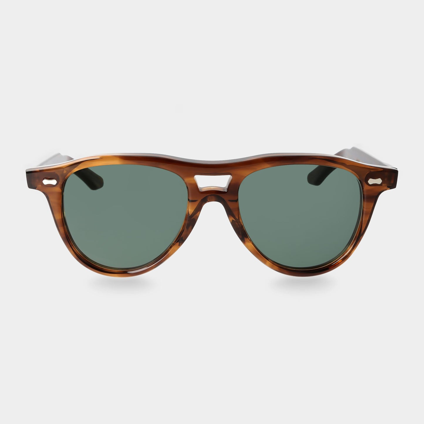Sunglasses with tortoiseshell frame and green lenses on a light gray background. - DEI DUCHI