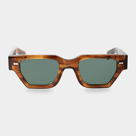 Sunglasses with tortoiseshell frame and green lenses on a white background. - DEI DUCHI