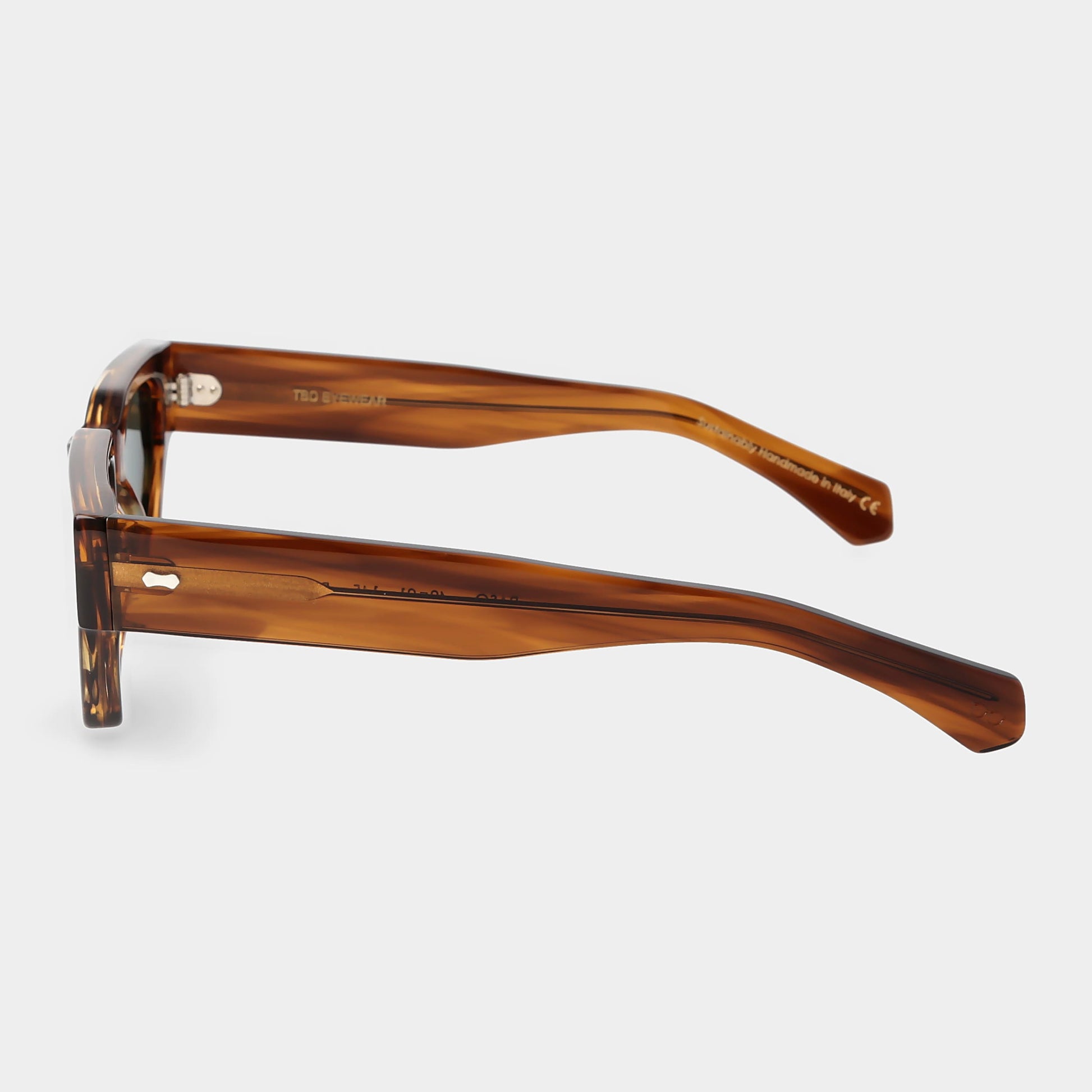 Sunglasses with tortoiseshell frame and dark lenses on a white background. - DEI DUCHI