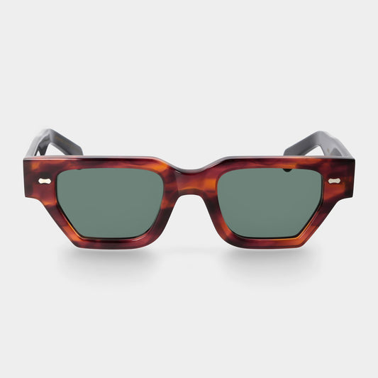 Sunglasses with tortoiseshell frame and dark lenses on a white background. - DEI DUCHI