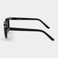 Round sunglasses with black frames and blue lenses on a light gray background. -DEI DUCHI