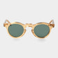 Gold-framed round sunglasses with green lenses on a light gray background. - DEI DUCHI