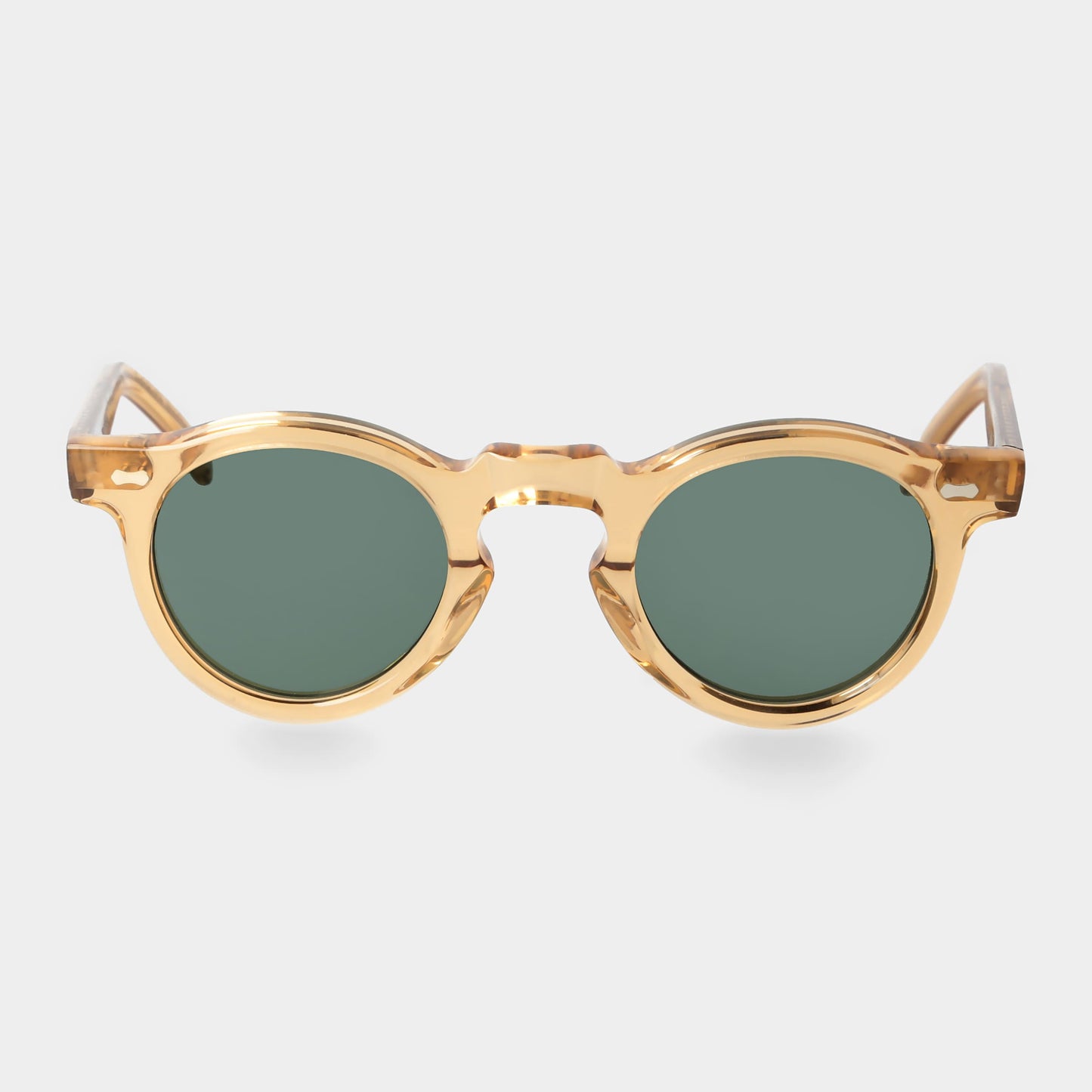 Gold-framed round sunglasses with green lenses on a light gray background. - DEI DUCHI