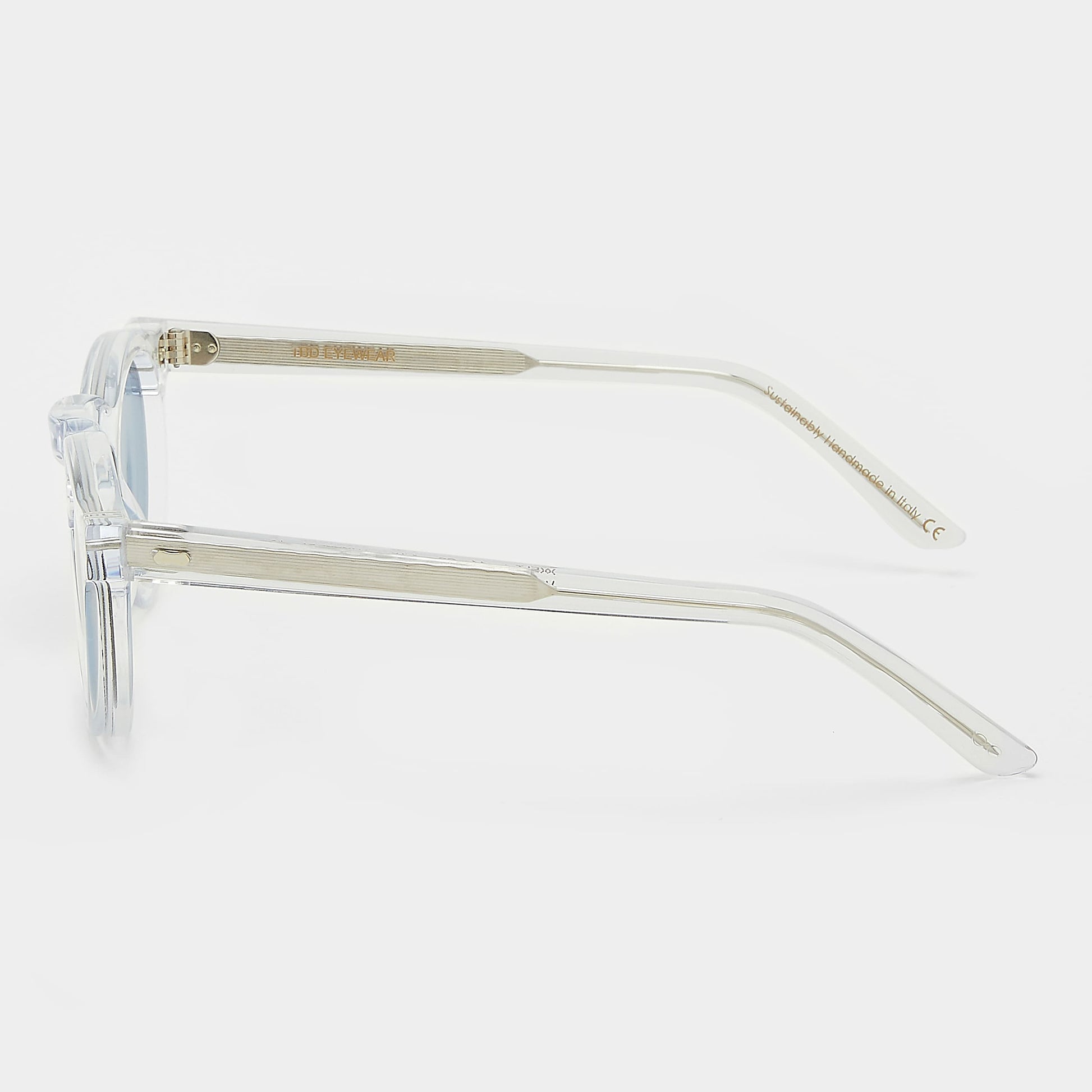 Clear frame sunglasses with blue lenses on a white background. - DEI DUCHI